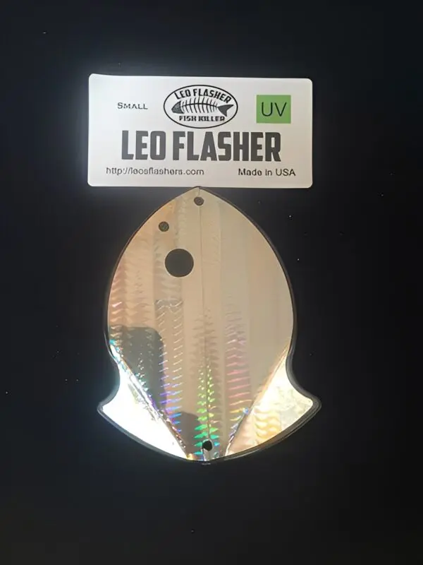 Fishing lure with packaging on black background.