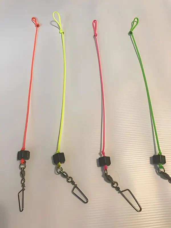 Four colorful fishing lanyards with clips.