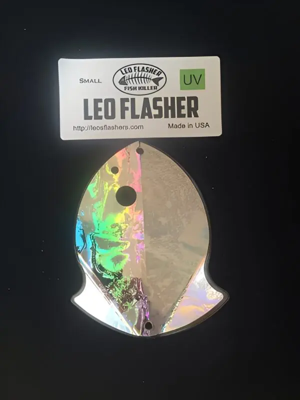 Holographic fish-shaped lure with label.