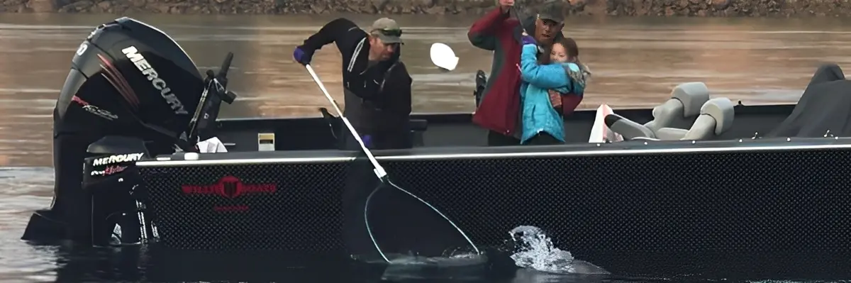 People fishing on a boat with net.