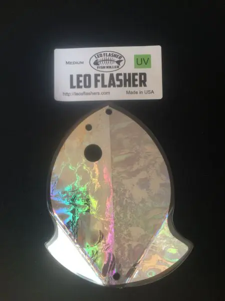 A fish-shaped LED flasher pack for fishing, with holographic colors.