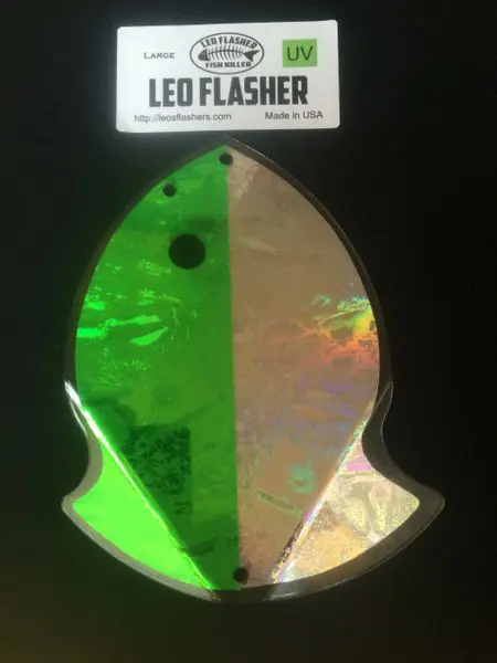 Holographic LED flasher shaped like a fish, reflecting green and silver.