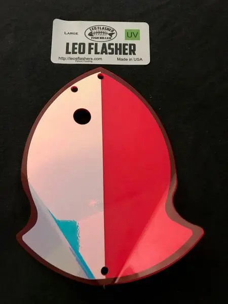 A two-toned, ghost-shaped LED flasher light with pink and white colors.