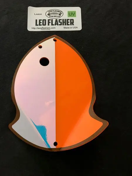 Orange and white LED flasher shaped like a ghost or flame.