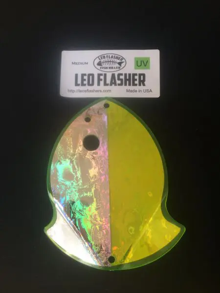 A shiny, fish-shaped LED flasher lure for fishing.