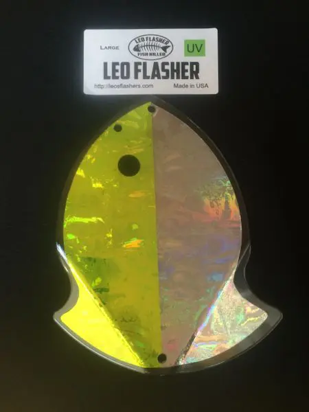 Reflective squid-shaped LED flasher with a black dot detail.