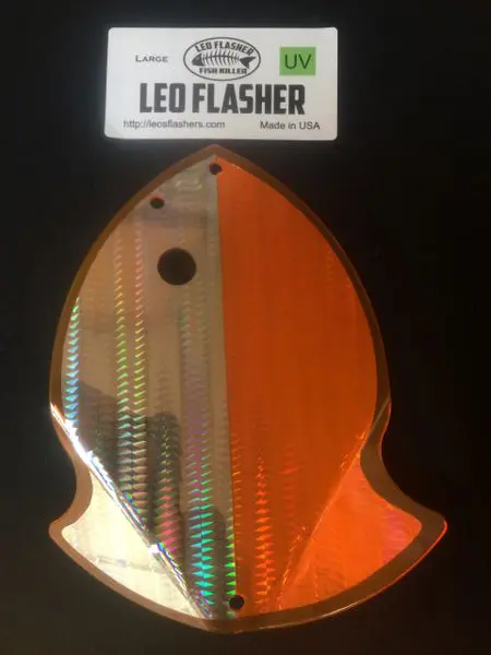 Orange and clear LED flasher light for vehicles, shaped uniquely.