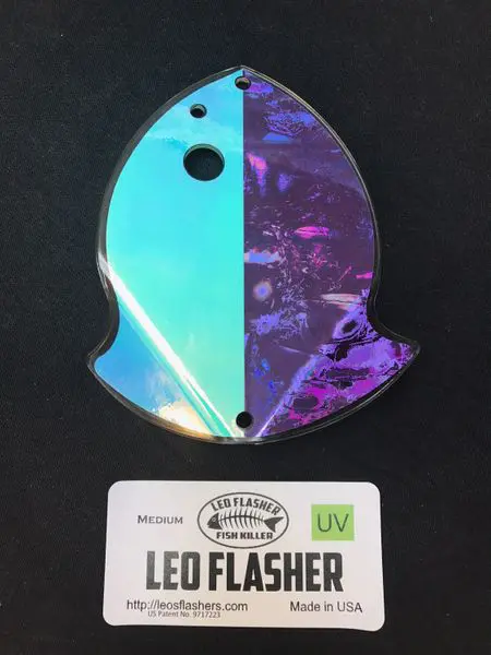 Colorful, translucent resin pendant with blue and purple halves.