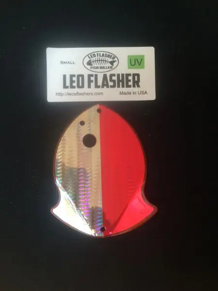 A colorful Leo Flasher fishing lure with a reflective finish.