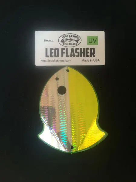 Holographic Leo Flasher fishing lure with a yellow head and reflective body.