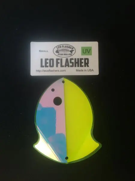 Colorful LED flasher keychain in fish shape with packaging.