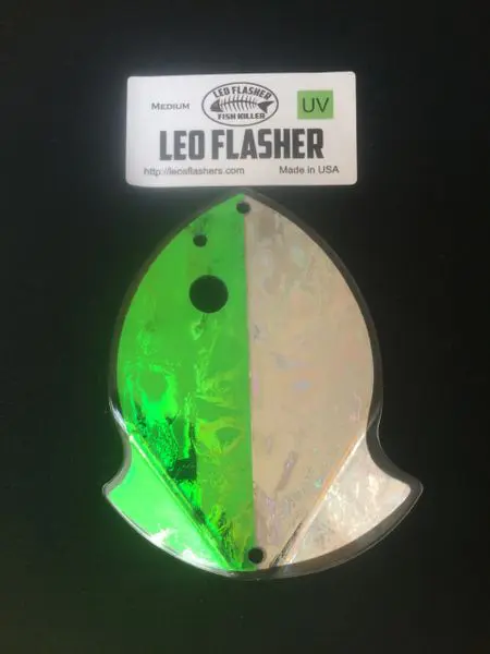 Green and silver LED flasher light in fish shape packaging.