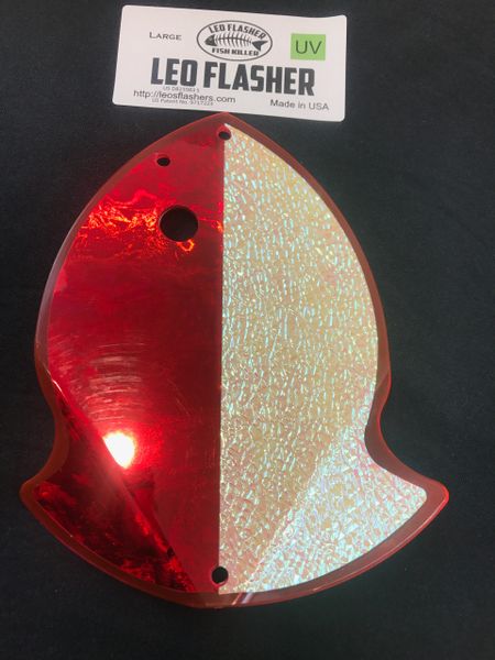 A red and white fish-shaped object with a hole near its center.